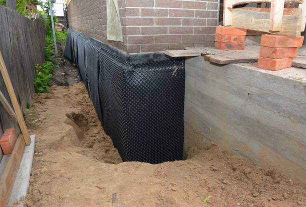 Happy homeowners after waterproofing job in Albany